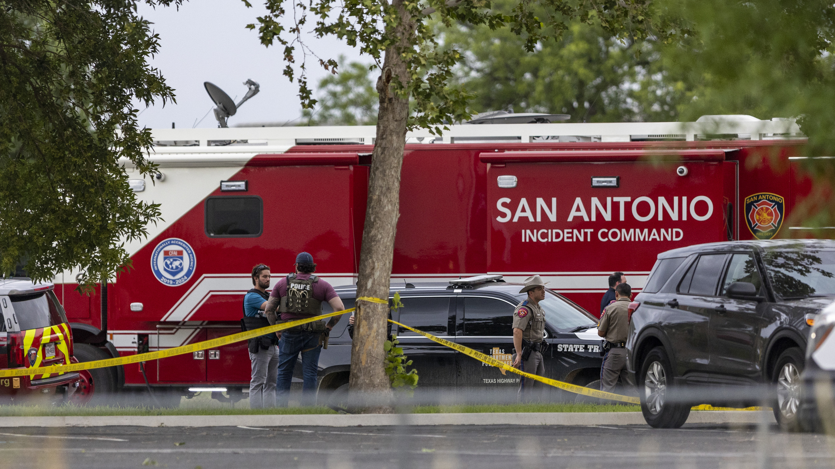 Equipment from the San Antonio Fire Department is parked outside Robb Elementary School in Uvalde, Texas.